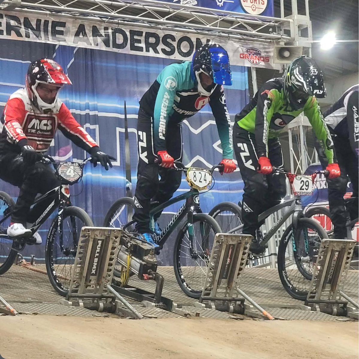 Racers on the gate at a BMX start ramp